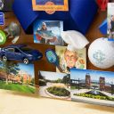 Large collage with over 65 items for the president of Creighton University. Close-up showcases miniaturized images and 3D items including a golf ball, mini car, and chef's hat.