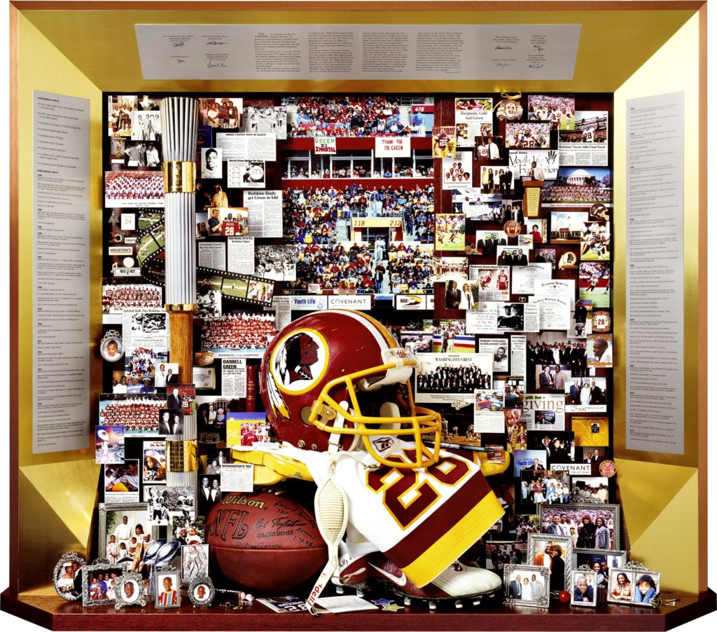 Darrell Green, Washington Redskins, retirement tribute. includes Olympic torch, football helmet, running shoes, framed family photos.