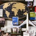 Large collage with over 50 items for Ernst and Young. This close-up shows a 3D metal globe and a mini plane.