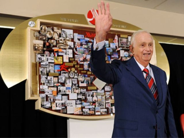Bill Marriott at Marriott 85th anniversary celebration with Marriott commemorative lobby art. Presented to Mr. Marriott to honor his leadership on his 80th birthday.