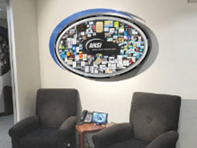 Commemorative collage for ANSI hanging on lobby wall