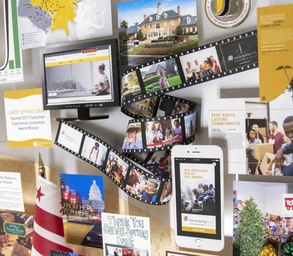 Close-up of 3D miniature objects in commemorative collage including film strip