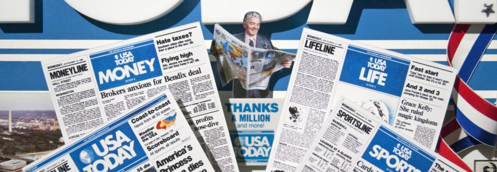 Close-up of miniaturized newspaper pages in commemorative collage