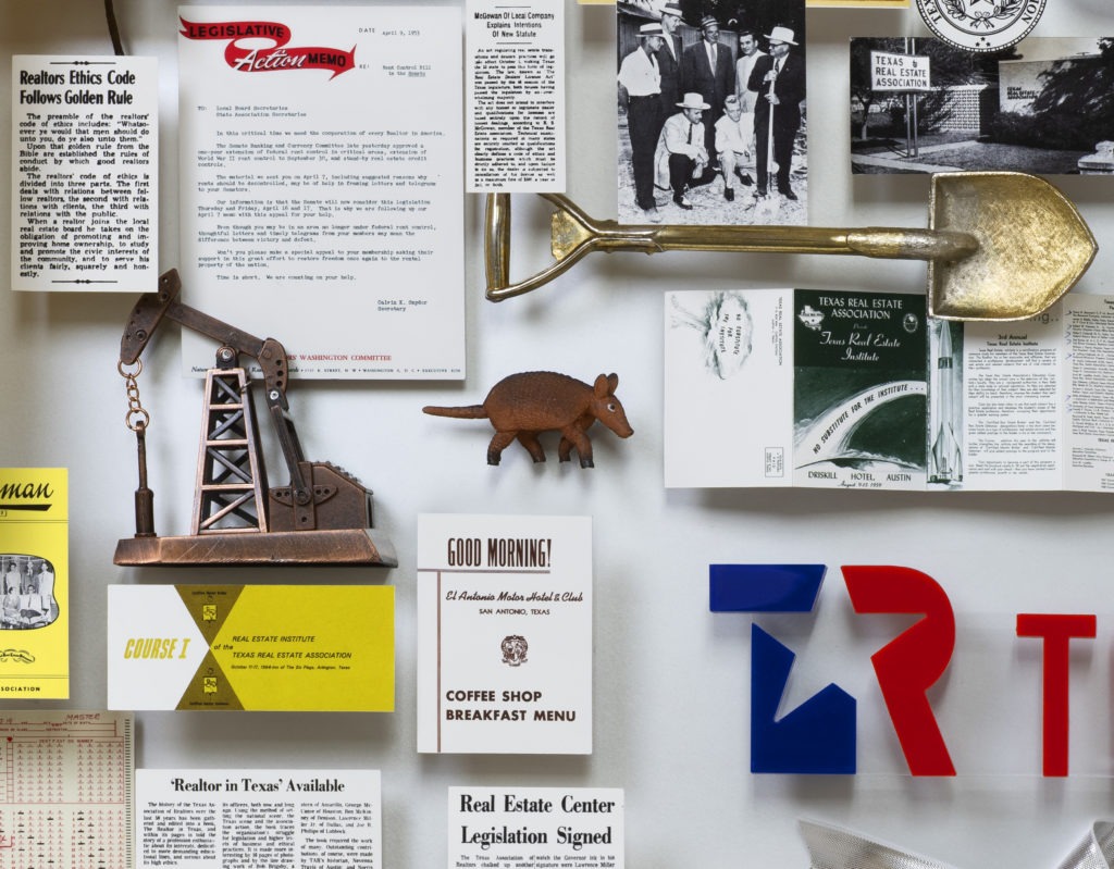 Close-up of 3D miniature objects in commemorative collage including armadillo