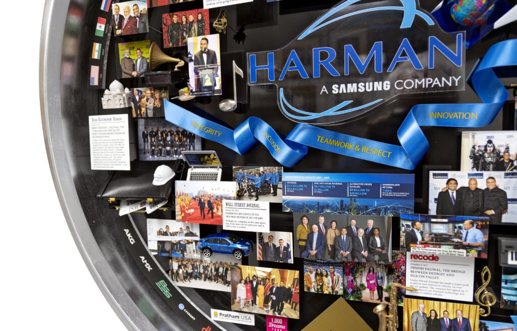Close-up of 3D miniature objects in commemorative collage including blue ribbon