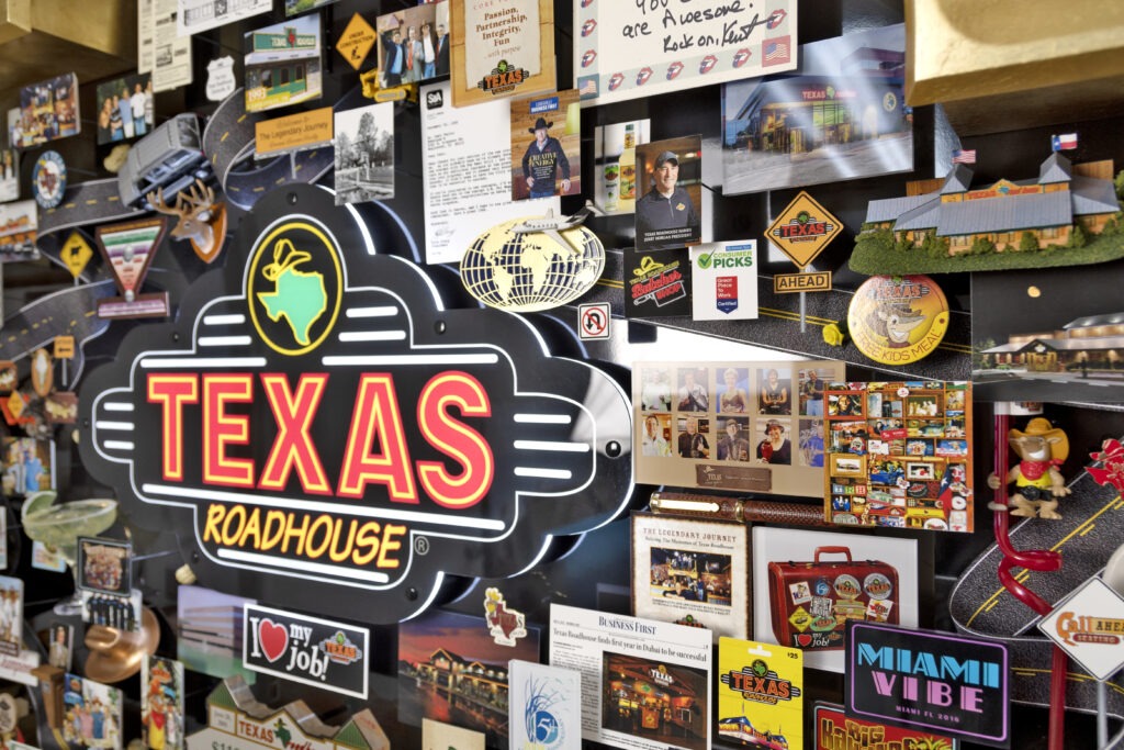 Large 3D collage for Texas Roadhouse celebrating the restaurant's story. Closeup of logo in neon lighting.