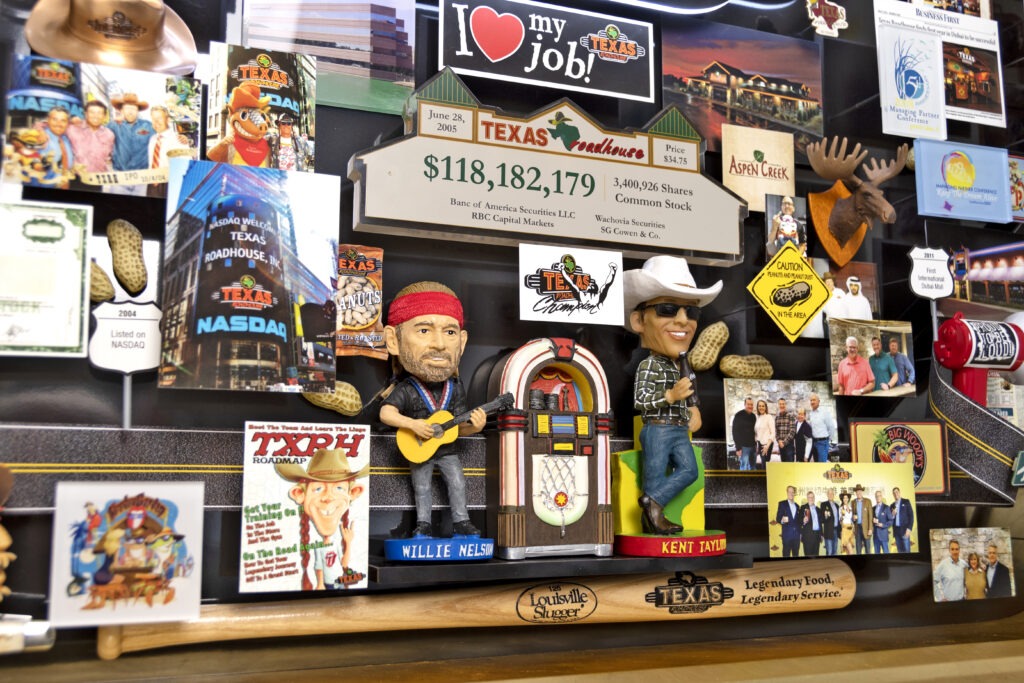 Large 3D collage for Texas Roadhouse. Bobble head of Willie Nelson and Kent Taylor next to jukebox. 