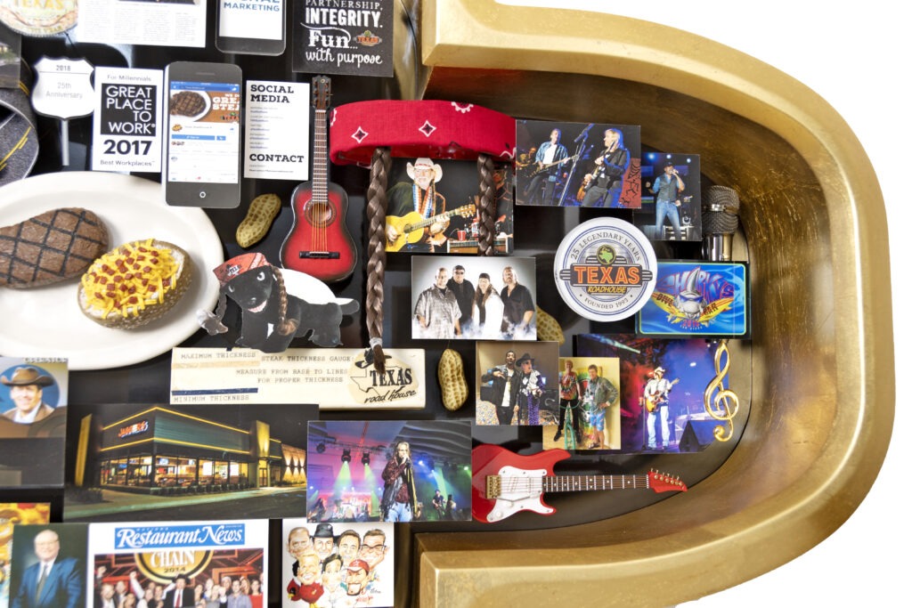 Closeup of large collage featuring miniature music related items, such as electric and acoustic guitar, microphone, and famous musicians. 