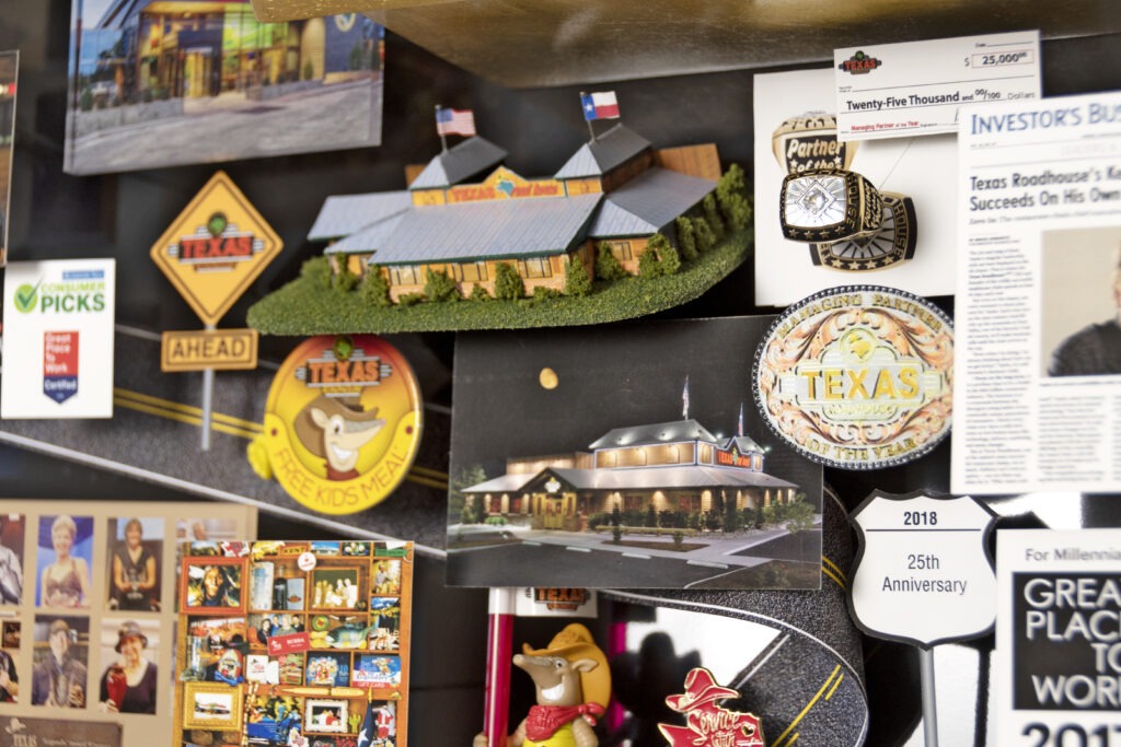 Large collage for Texas Roadhouse featuring many miniature 3D items including a replica of the restaurant. 