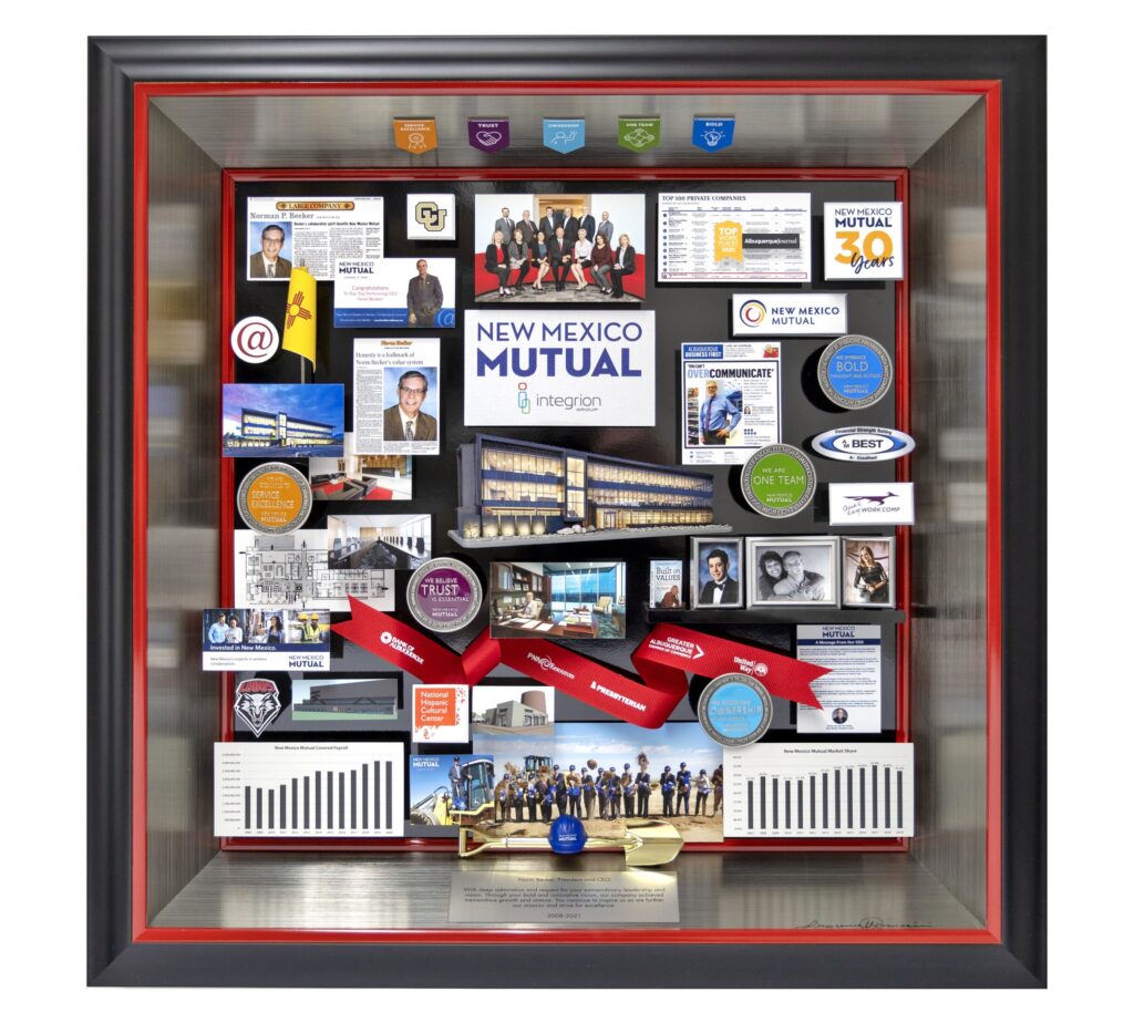 Collage containing miniaturized photos, publications, and 3D items. Includes challenge coins, mini hardhat and shovel, and ribbon.