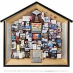 Large 3D collage with miniaturized photos, books, and 3D items including a school bus, laptop, globe, crayons, and school desk.