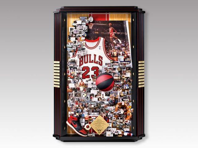 Tall shadow box collage presented to Michael Jordan which includes a jersey, shoe, and other memorabilia