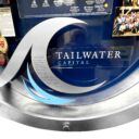 Close-up of 3D miniature objects in commemorative collage including silver metal ocean wave
