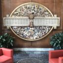 Large shadow box collage hanging in lobby that commemorates American Academy of Orthopaedic Surgeons 75th Anniversary