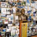 Close-up of 3D miniature objects in commemorative collage including bust of founder