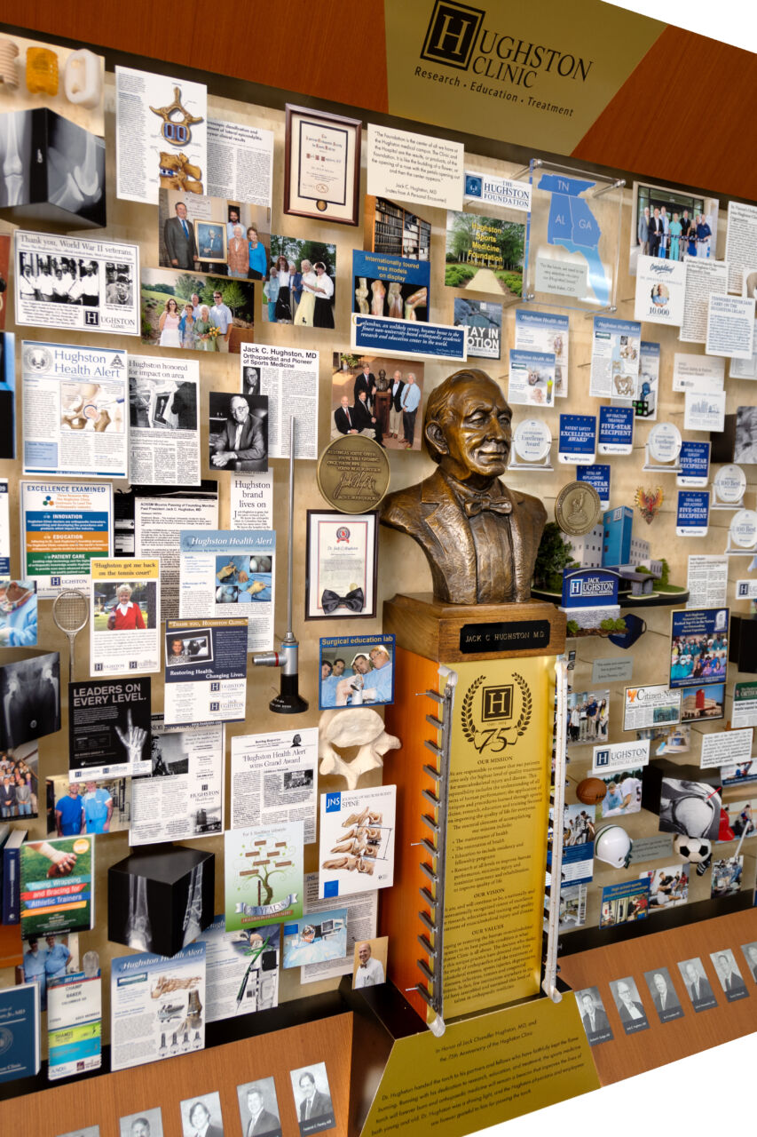 Close-up of 3D miniature objects in commemorative collage including bust of founder
