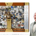 Artist Lawrence Romorini standing next to the large shadow box collage commemorating Hughston Clinic's 75th Anniversary