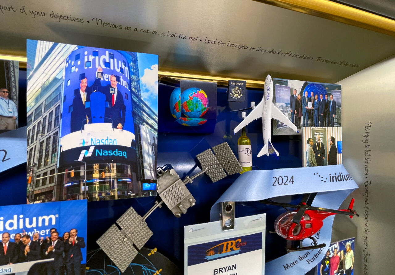 Close-up of satellite ornament and 3D miniatures inside collage