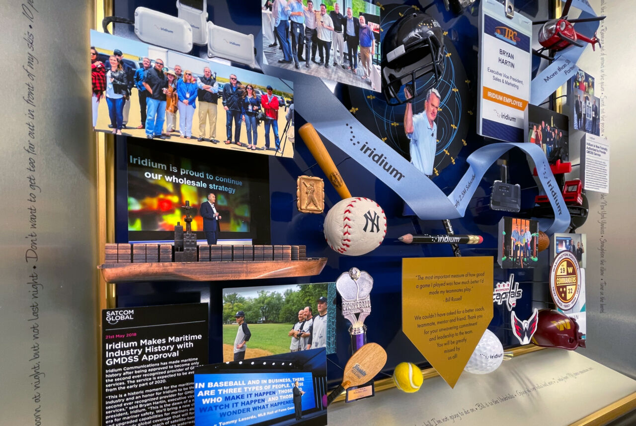 Close-up of dedication plaque and 3D miniatures inside collage
